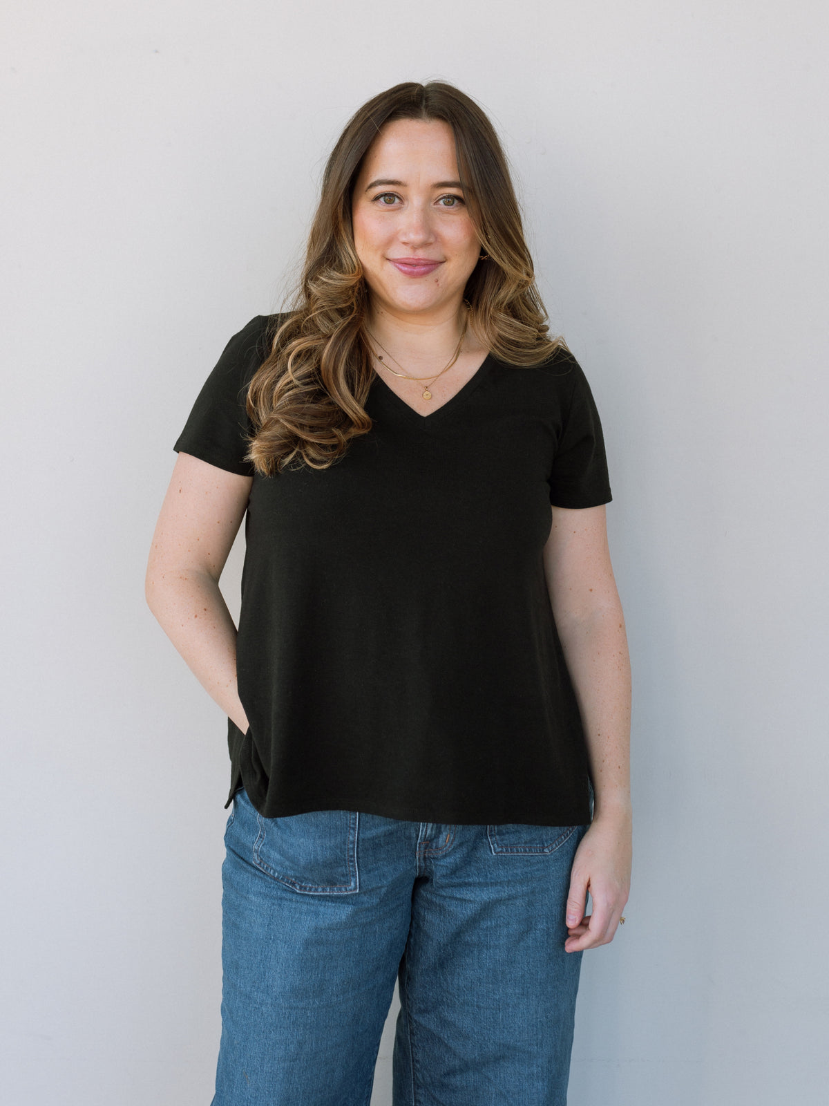 Simple black nursing-friendly shirt with hidden access.
